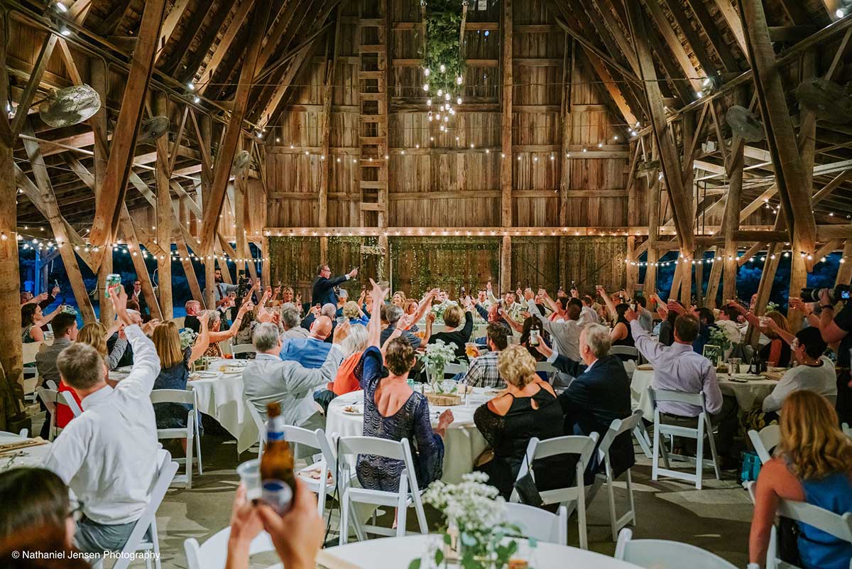 Guests Raise their Glasses at Historic Barns Reception