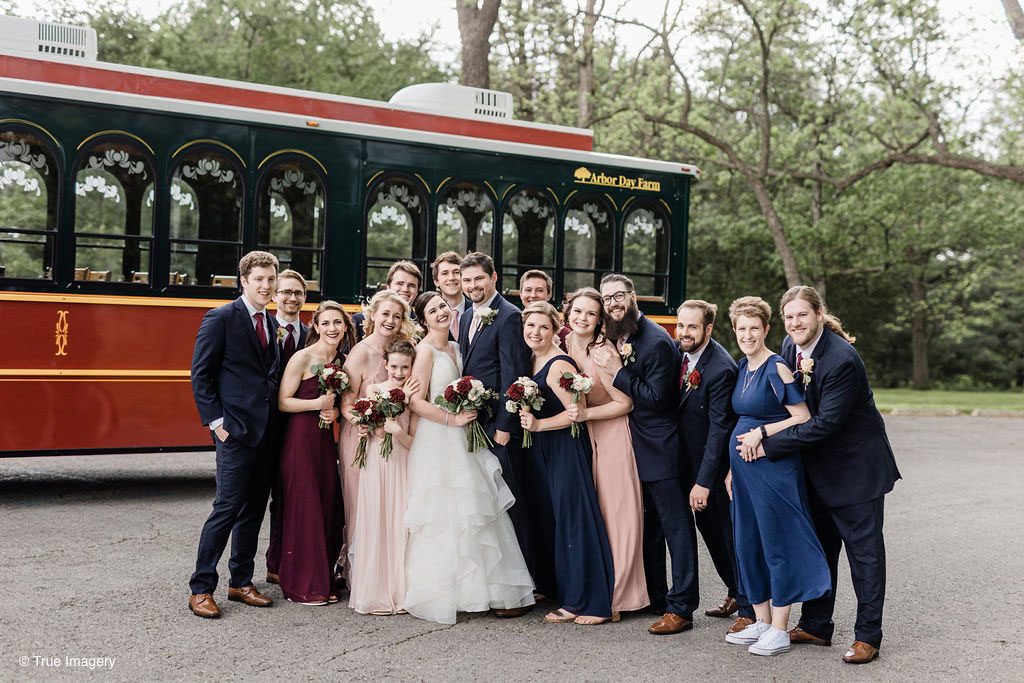 Wedding Party in Front of Trolley in Summer Wedding
