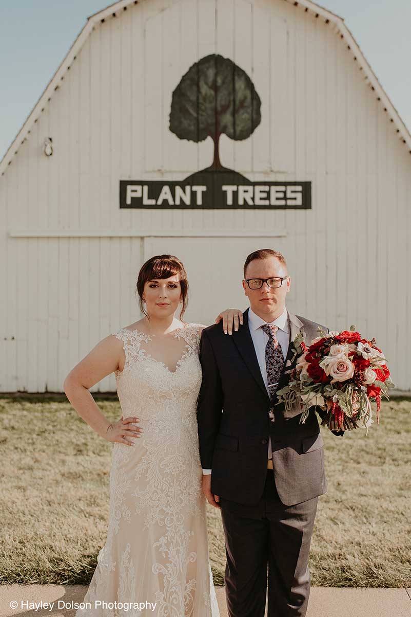 Bride and Groom in Front of the Historic Barns