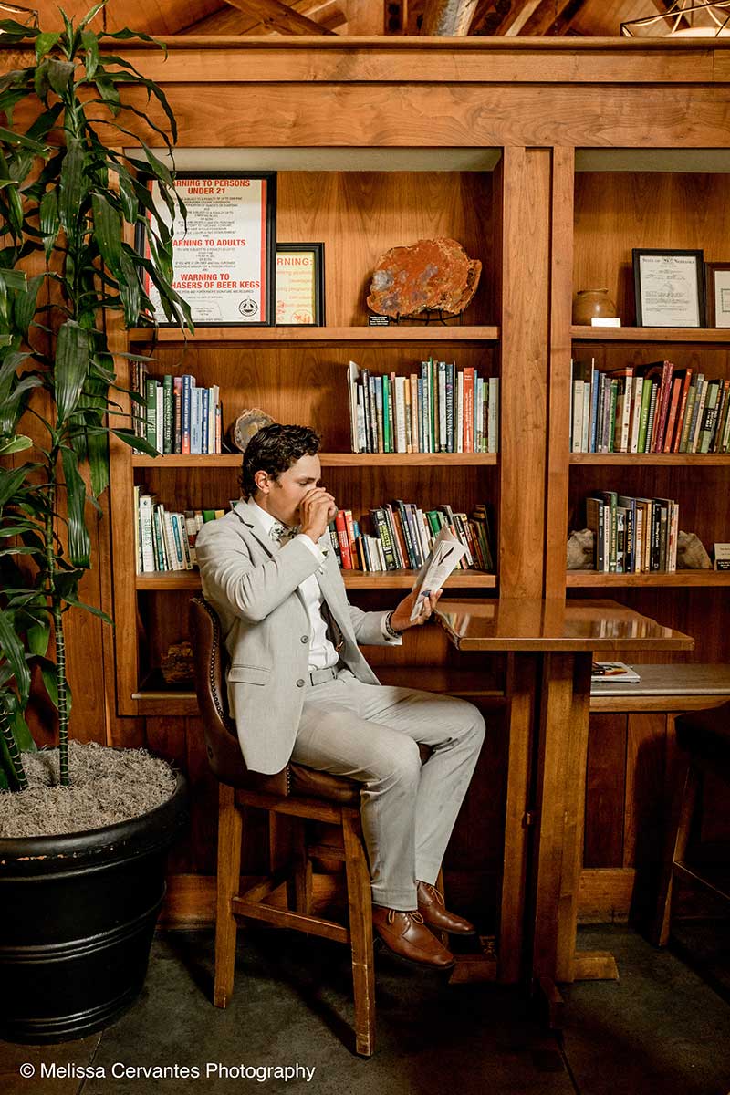 A Groom Enjoys a Drink at Library Lounge