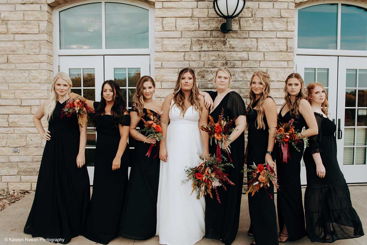A Bride and Her Bridesmaids Pose Outside