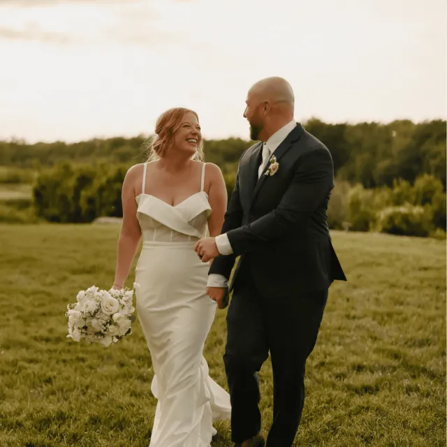 Couple outdoors getting married and looking at each other.