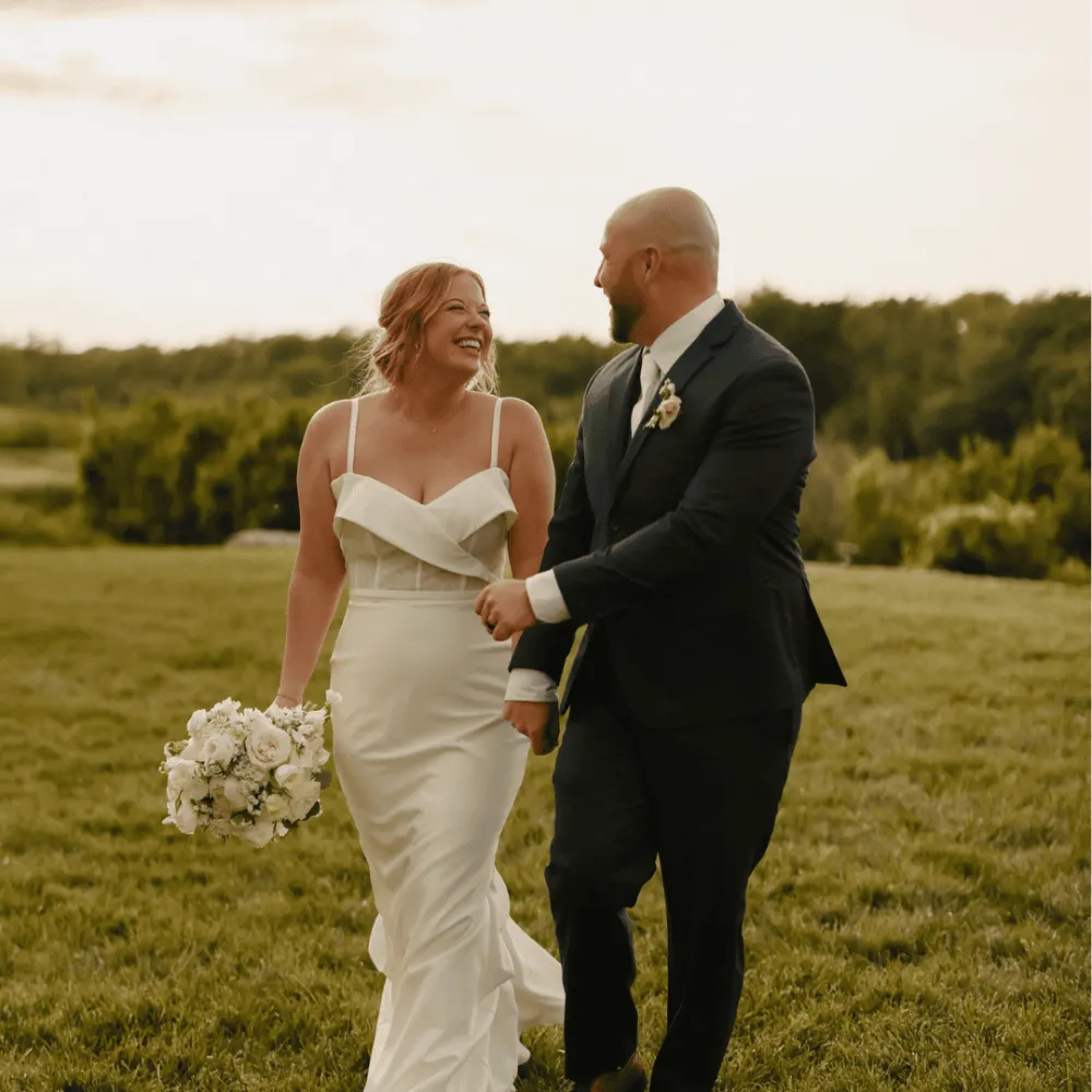 Couple outdoors getting married and looking at each other.