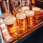 A tray of beer glasses.